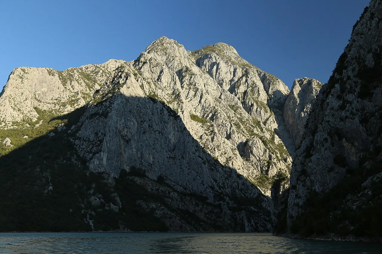 Limestone cliffs rising above Lake Koman, seen from the passenger ferry.