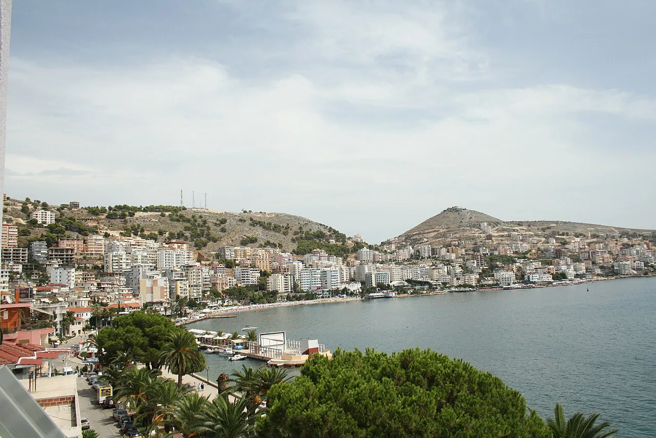 Sarandë's southern seafront and bay seen from above.