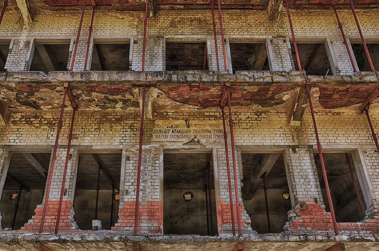 The decaying facade of the prisoners' quarter at the former Spaç prison.