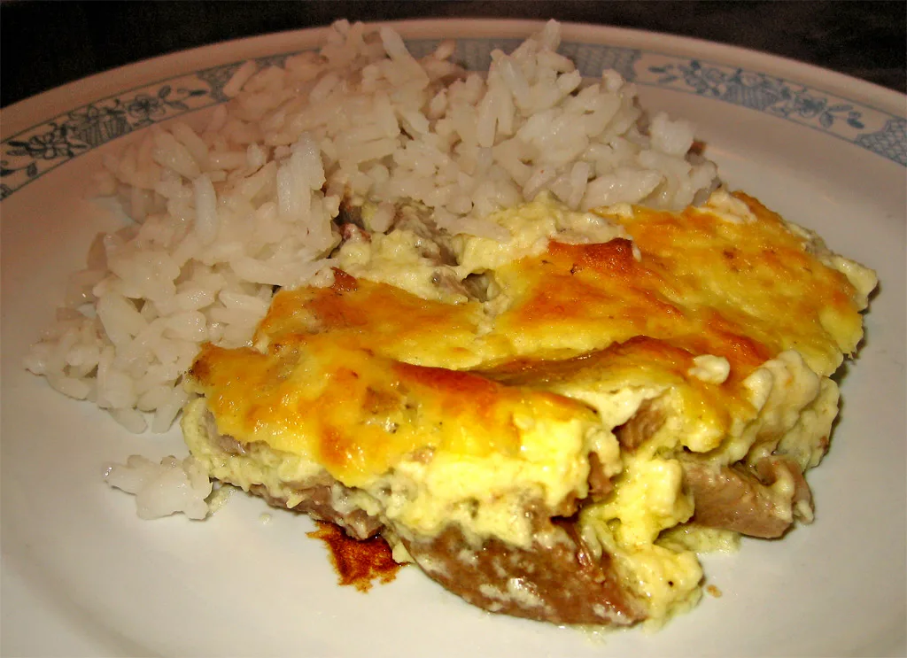 A portion of tavë kosi served with rice.