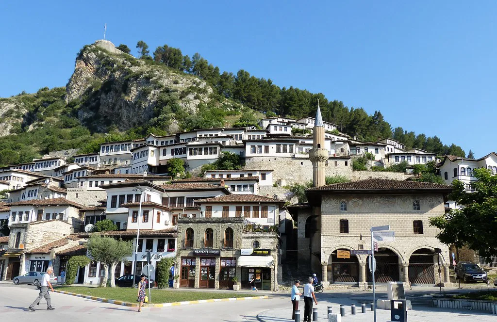 White Ottoman houses of Berat's old quarter climbing the hill below the castle.