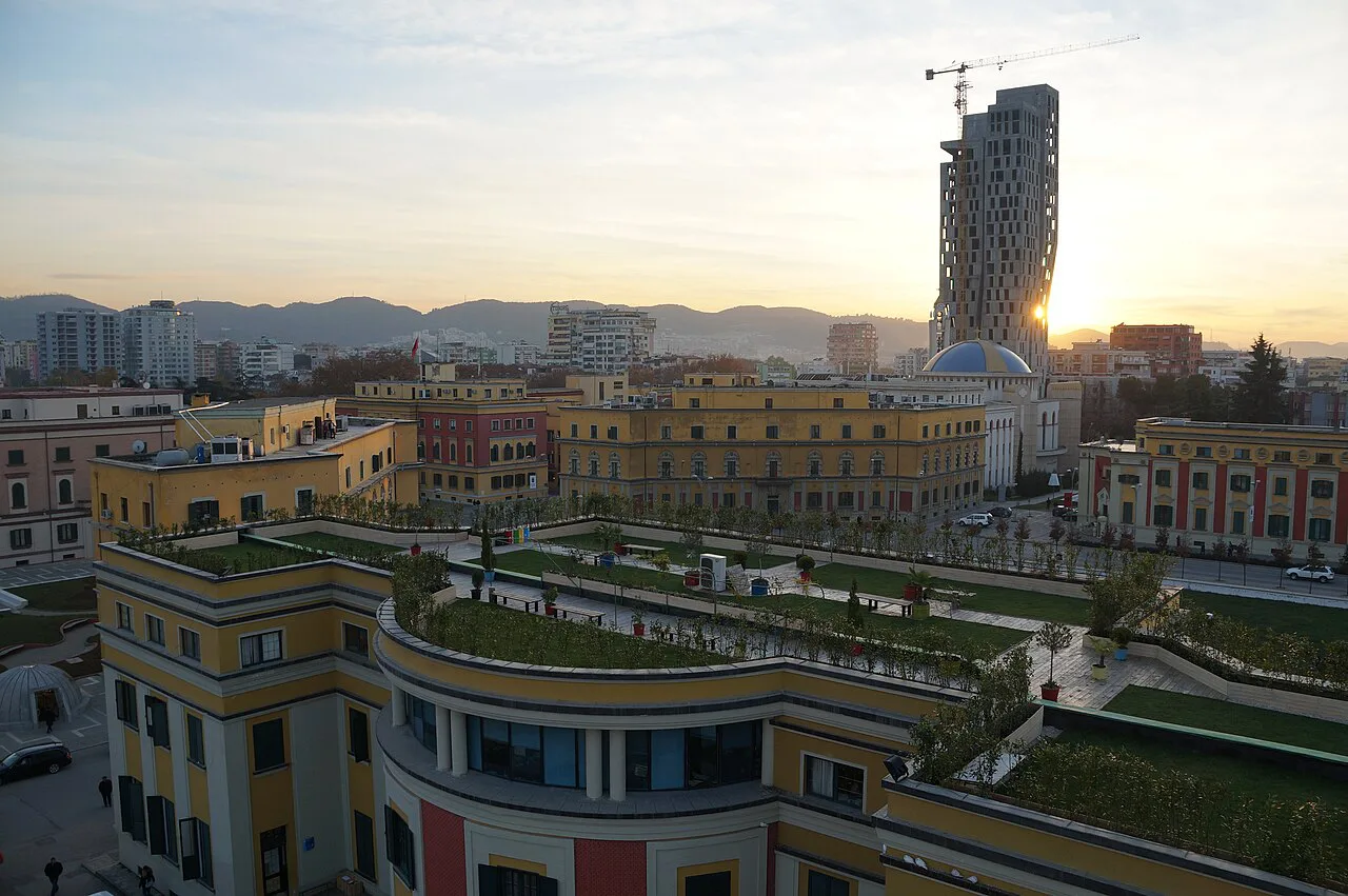 Sunset over the Tirana skyline around Skanderbeg Square.