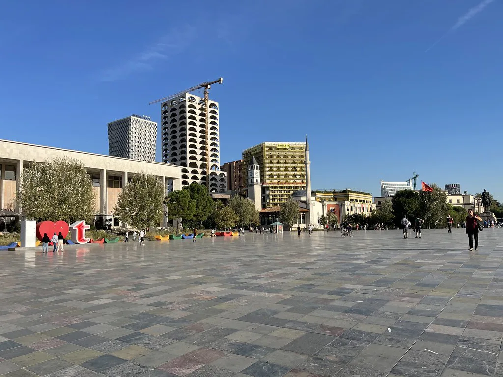 Skanderbeg Square in central Tirana with high-rise towers behind.