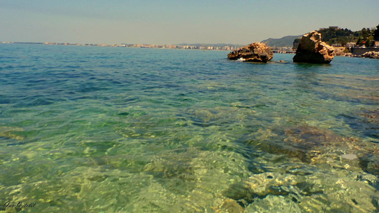 Clear water and rocks along the shore at Uji i Ftohtë near Vlorë.