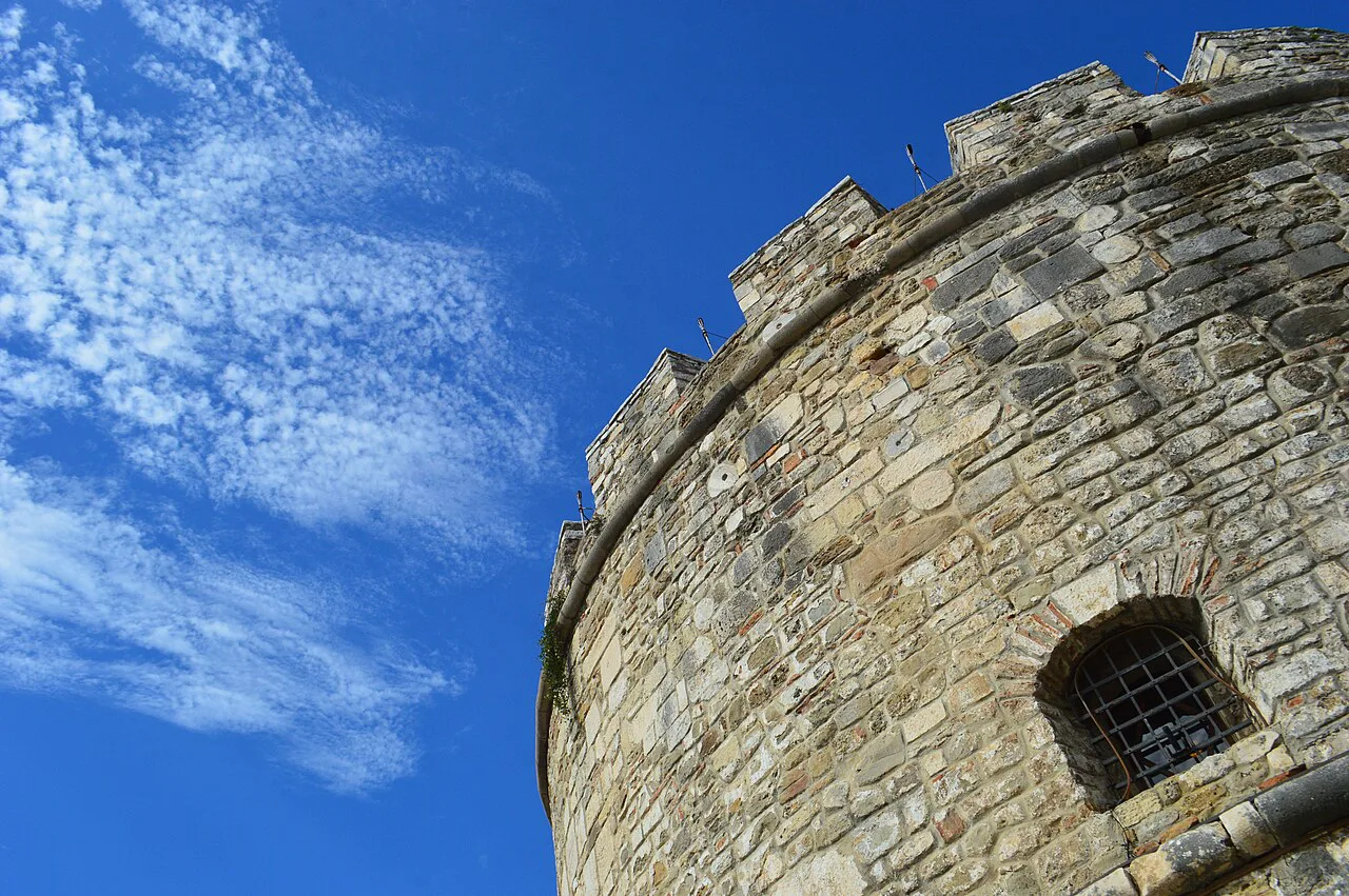 The crenellated stone wall of the Venetian Tower in Durrës.