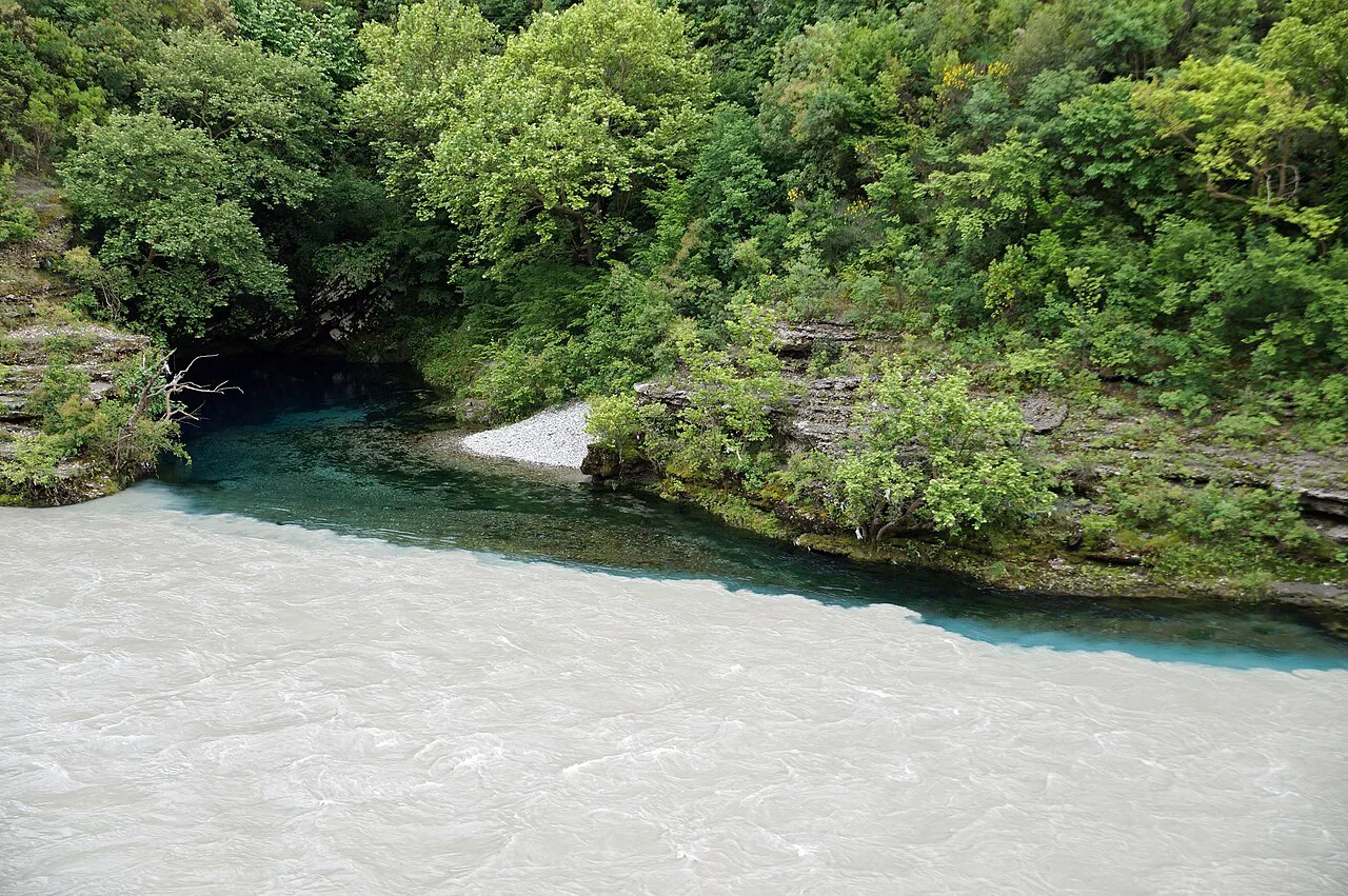 The Black Water spring joining the Vjosa River at Këlcyrë.