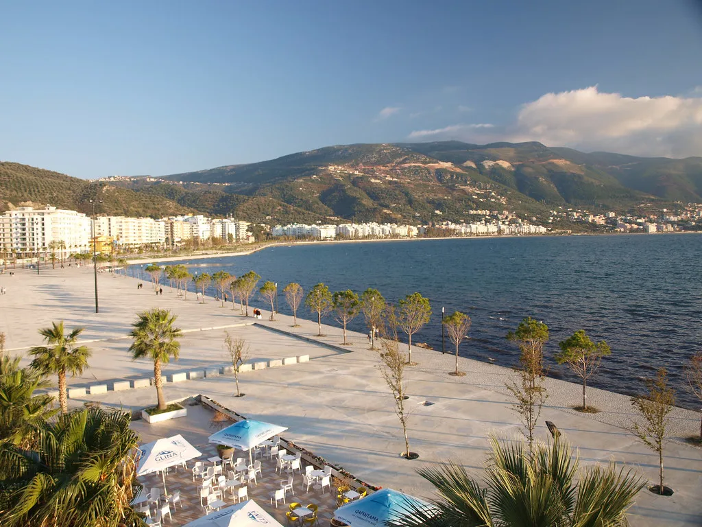 The seafront promenade curving along the Bay of Vlorë.