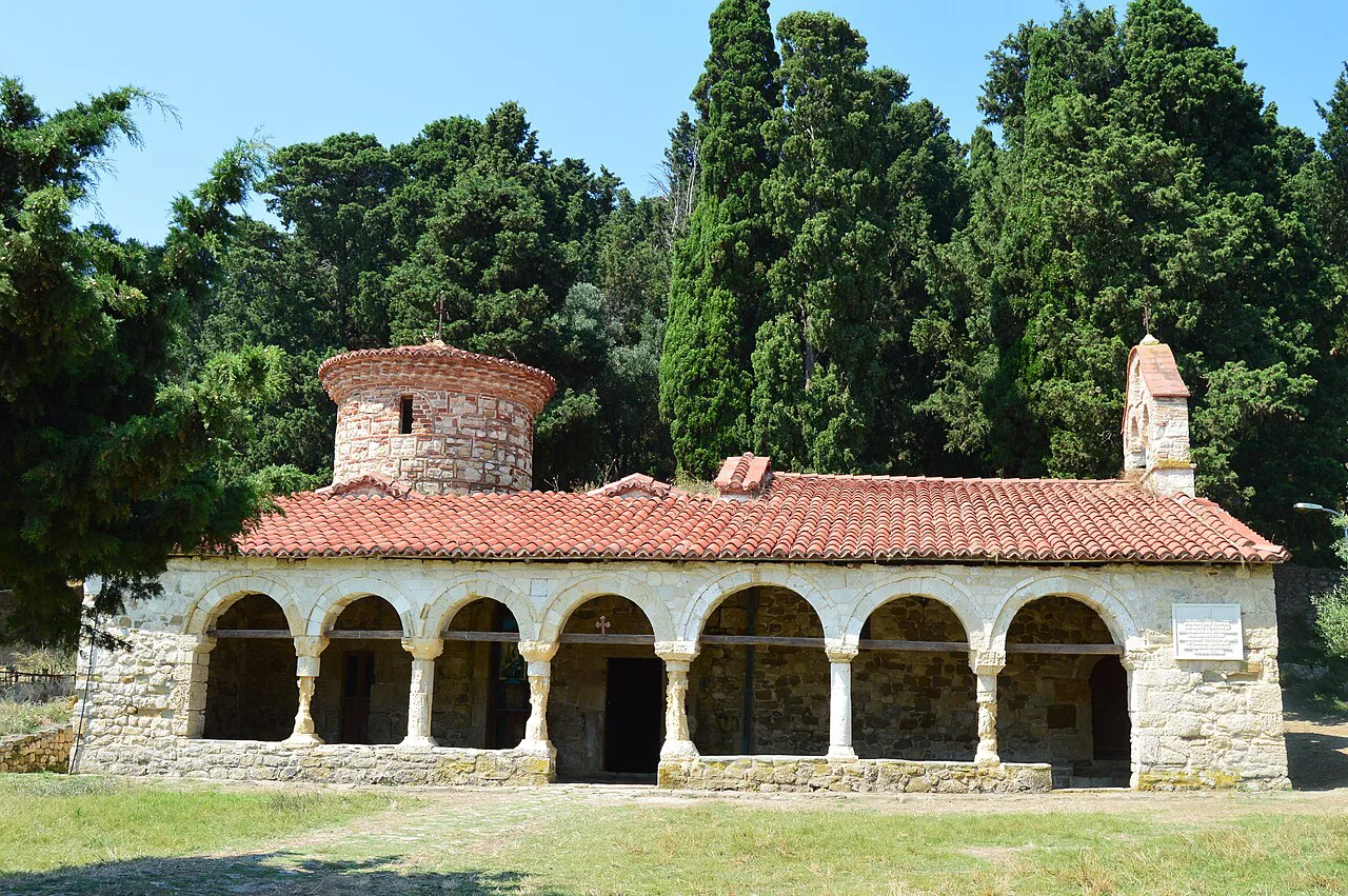 The church of Zvërnec Monastery among the trees.